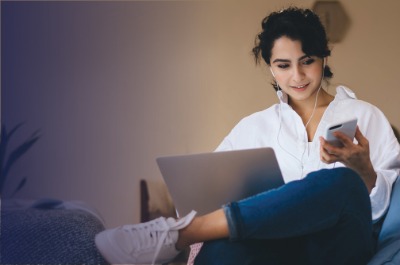 Woman on laptop and phone